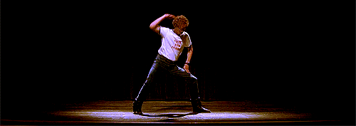 Napoleon Dynamite dancing on stage with confidence 